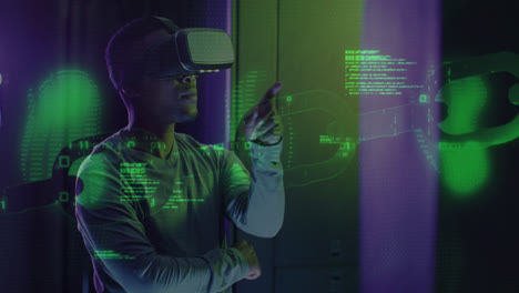 Animation-of-data-processing-over-african-american-male-worker-with-vr-headset-in-server-room