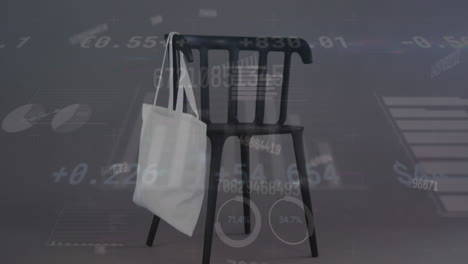 Animation-of-changing-numbers,-graphs,-loading-circles,-bag-hanged-on-chair-against-gray-background