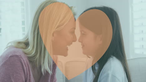 Animation-of-heart-over-caucasian-mother-and-daughter