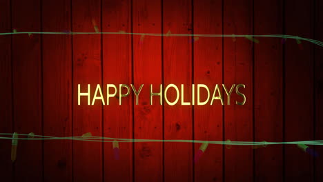Animation-of-happy-holidays-text-and-fairy-lights-on-wooden-background