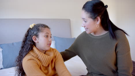 Biracial-mother-and-daughter-share-a-moment-at-home