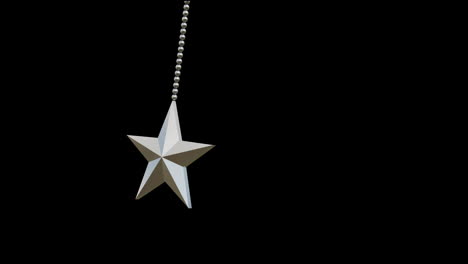 Animation-of-star-christmas-bauble-decoration-over-black-background