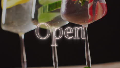 Animation-of-open-neon-text-and-cocktails-on-black-background