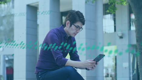 Animation-of-graphs-and-changing-numbers-over-asian-man-using-digital-tablet-in-outdoors