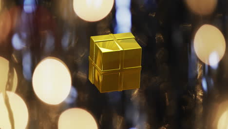 Animation-Einer-Weihnachtsdekoration-Mit-Geschenken-über-Flackernden-Scheinwerfern-Auf-Blauem-Hintergrund