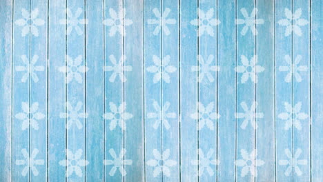 Animation-of-snowflakes-christmas-pattern-on-blue-background