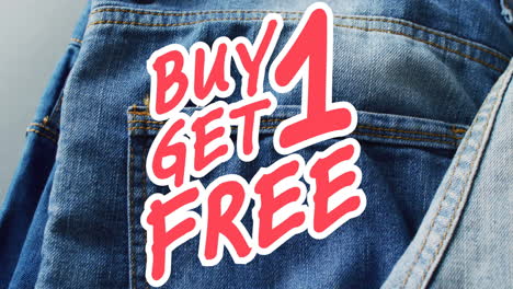 Animation-of-buy-1-get-1-free-text-over-denim-trousers-background