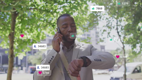 Animation-of-notification-bars,-african-american-man-looking-at-smartwatch-while-talking-on-phone