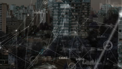 Animation-of-connected-graph-and-number-icons-over-modern-buildings-in-city