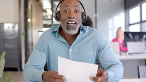 Business-African-American-man-reviews-documents-in-an-office