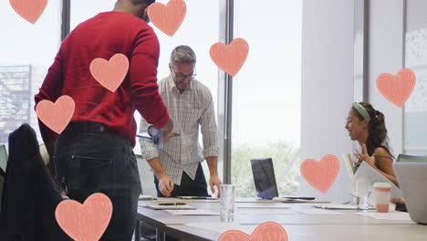Animation-of-pink-hearts-over-diverse-business-people-in-office