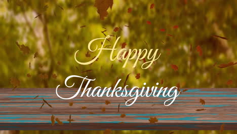 Animation-of-happy-thanksgiving-text-over-leaves-and-wooden-table-against-trees
