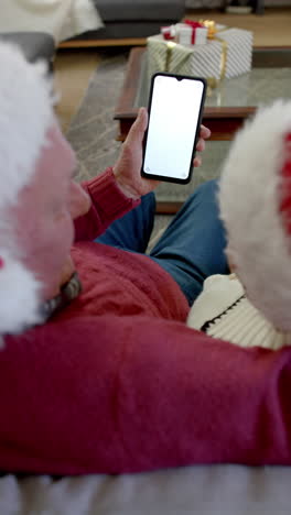 Vertical-video-of-senior-caucasian-couple-using-smartphone-with-copy-space-on-screen,-slow-motion