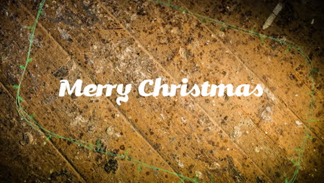 Animation-of-merry-christmas-text-and-fairy-lights-on-wooden-background