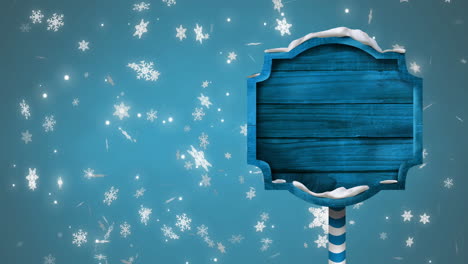 Animation-of-christmas-sign-with-copy-space-with-glowing-spots-on-blue-background