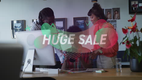 Animation-of-huge-sale-text-over-diverse-people-using-computer