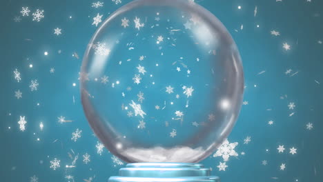 Animation-of-snow-globe-over-snow-falling-on-blue-background