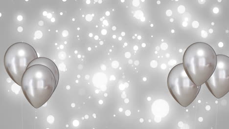 Animation-of-silver-balloons-over-silver-background