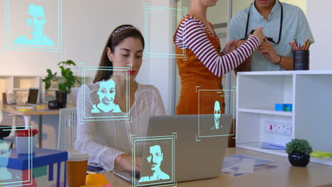 Animation-Von-Profilsymbolen-über-Einer-Kaukasischen-Geschäftsfrau,-Die-Im-Büro-Am-Laptop-Arbeitet