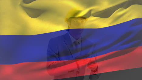Animation-of-colombian-flag,-caucasian-engineer-wearing-helmet-checking-blueprint