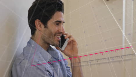 Animation-of-arrow-on-falling-graph-and-grid-pattern-over-caucasian-man-talking-on-smartphone