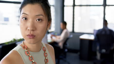 Portrait-of-asian-businesswoman-in-office,-slow-motion,-copy-space