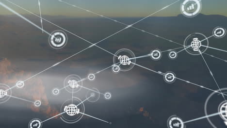 Animation-of-connected-icons-over-aerial-view-of-forest-against-sky