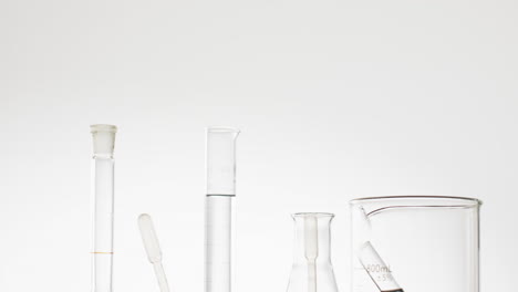 Video-of-glass-laboratory-test-tubes-and-dishes-with-copy-space-on-white-background