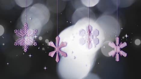 Animation-of-christmas-baubles-and-snow-falling-on-black-background