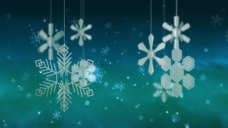 Animation-of-christmas-baubles-and-snow-falling-on-blue-background