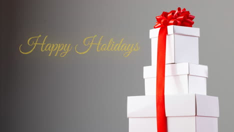 Animation-of-happy-holidays-text-over-presents-on-grey-background