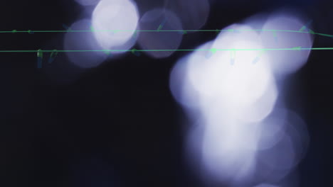 Animation-of-flickering-fairy-lights-over-spots-of-light-background