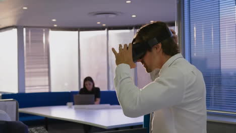 Animation-of-profile-icon-in-circles-over-caucasian-man-experiencing-vr-headset-in-office