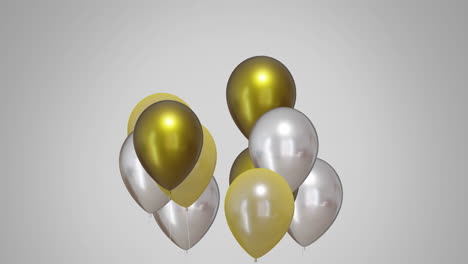 Animation-of-gold-and-silver-balloons-over-white-background