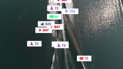 Animation-of-numbers,-icons-in-notification-bars,-aerial-view-of-boat-moving-in-ocean
