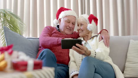 Happy-senior-caucasian-couple-spending-time-together-at-home-at-christmas,-slow-motion