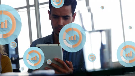 Animation-of-graph-icon-in-circles-over-biracial-man-scrolling-on-digital-tablet-in-office