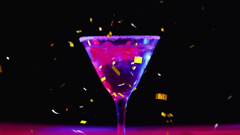 Animation-of-confetti-falling-and-cocktail-on-black-background