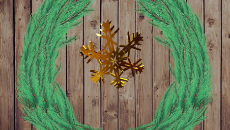 Animation-of-gold-snowflake-christmas-decoration-and-green-branches-on-wooden-background
