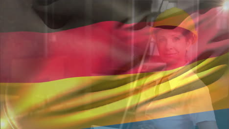 Animation-of-german-flag,-smiling-caucasian-female-engineer-wearing-helmet-and-holding-blueprints