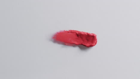 Video-of-lipstick-smudge-with-copy-space-on-white-background
