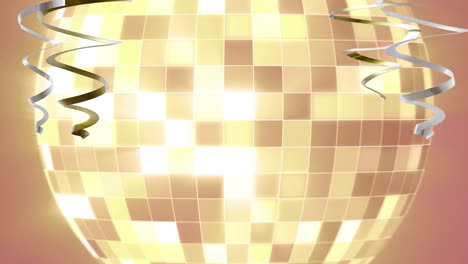 Animation-of-gold-and-silver-streamers-over-mirror-ball-on-orange-background