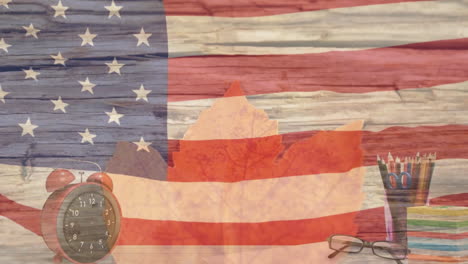 Animation-Der-Amerikanischen-Nationalflagge,-Die-über-Buntstiften,-Brillen-Und-Einem-Wecker-Weht