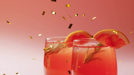 Animation-of-confetti-falling-and-cocktail-on-pink-background
