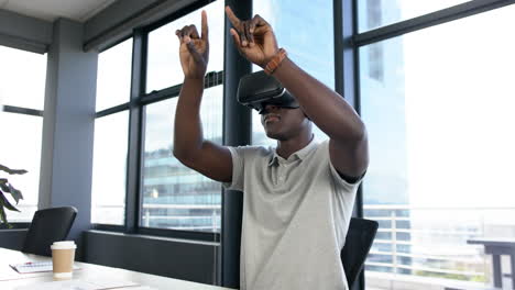 African-american-businessman-using-vr-headset-in-office,-slow-motion,-copy-space