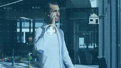 Animation-of-changing-numbers,-multiple-icons-over-caucasian-man-standing-and-talking-on-cellphone