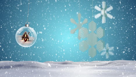 Animation-of-glass-bauble-over-snow-falling-on-blue-background