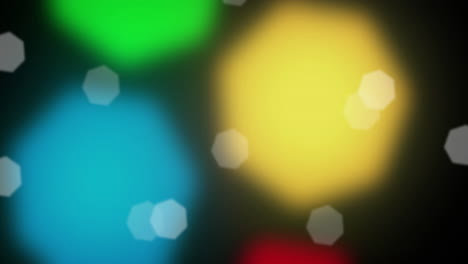 Animation-of-spots-falling-over-multi-coloured-spots-on-black-background