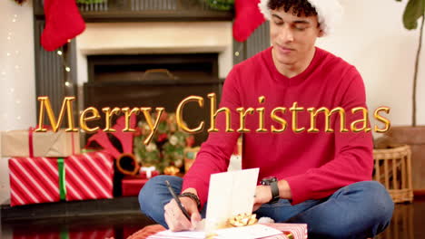 Animation-of-happy-holidays-text-over-caucasian-man-writing-christmas-cards-with-presents
