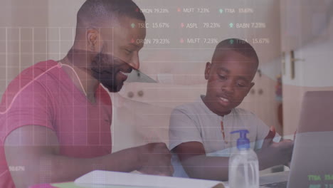 Animation-of-trading-board-and-graphs-over-african-american-father-and-son-studying-over-laptop